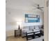Cozy living room with a modern ceiling fan, stylish sofa, and contemporary artwork creating an inviting atmosphere at 14501 Grove Resort Ave # 2440, Winter Garden, FL 34787