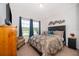 Bedroom with neutral walls and carpet, with a floral bedspread at 16379 Blooming Cherry Dr, Groveland, FL 34736