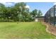 Spacious backyard with ample shade, a shed for storage, and a view of the screened-in pool at 17523 Doris St, Montverde, FL 34756