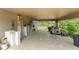 Large carport with ample storage space, featuring a view of the backyard at 17523 Doris St, Montverde, FL 34756