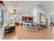 Open kitchen with breakfast bar, eat-in kitchen, tile floors, and modern lighting at 17523 Doris St, Montverde, FL 34756