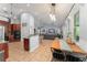 Open kitchen with an eat-in kitchen and breakfast bar seamlessly connecting to the living area at 17523 Doris St, Montverde, FL 34756