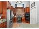 Classic kitchen with built-in ovens, wood cabinetry and tile floors at 17523 Doris St, Montverde, FL 34756