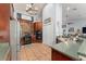 Well-lit kitchen featuring dual built-in ovens and dark wood cabinetry at 17523 Doris St, Montverde, FL 34756