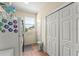 A neutral laundry room with a full size fridge, storage cabinets, and a window to the outside at 17523 Doris St, Montverde, FL 34756