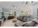 Inviting living room with tile floors, comfortable seating, and natural light, creating a cozy atmosphere at 17523 Doris St, Montverde, FL 34756