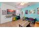 Vibrant game room with fun decor, a neon light, and workspace with multi-colored chairs at 17523 Doris St, Montverde, FL 34756