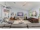 Open concept living room featuring tile floors, and a cozy seating area for relaxation and entertainment at 17523 Doris St, Montverde, FL 34756