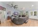 Open concept living room featuring tile floors, and a cozy seating area for relaxation and entertainment at 17523 Doris St, Montverde, FL 34756