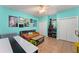 A brightly painted room, set up with games and decorated with vintage arcade posters at 17523 Doris St, Montverde, FL 34756