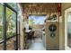 Tiki bar and compact outdoor kitchen including a sink, grill, and mini refrigerator at 17523 Doris St, Montverde, FL 34756