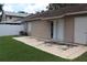 Backyard with lawn and stone tiled patio with house exterior at 1827 Blaine Ter, Winter Park, FL 32792