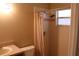 Bathroom featuring a shower with tile surround and a neutral colored shower curtain, and sink vanity at 1827 Blaine Ter, Winter Park, FL 32792