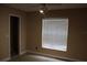 Bedroom with a window, ceiling fan, and carpeted floor provides a relaxing retreat at 1827 Blaine Ter, Winter Park, FL 32792