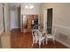 Dining area with hardwood floors, a glass table with wicker chairs and a built in desk at 1827 Blaine Ter, Winter Park, FL 32792
