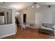 Open living room with dining area, desk space, laminate floors, ceiling fan and a comfortable couch at 1827 Blaine Ter, Winter Park, FL 32792