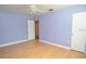 Spacious bedroom with hardwood floors and fresh, light-blue painted walls at 1975 Waldo St, Orlando, FL 32806