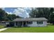 Charming single-story home with a well-maintained lawn and cozy front porch at 1975 Waldo St, Orlando, FL 32806