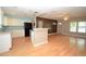 Open concept kitchen with breakfast bar flowing into living area at 1975 Waldo St, Orlando, FL 32806