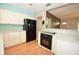 Kitchen with modern appliances and view of the living room at 1975 Waldo St, Orlando, FL 32806