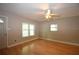 Bright living room featuring light-colored walls, hardwood floors, and a ceiling fan at 1975 Waldo St, Orlando, FL 32806