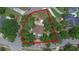 Aerial view of the property surrounded by mature trees in a well-established neighborhood at 202 Ferryboat Ct, Orlando, FL 32828