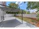 Backyard featuring patio with sun shade and landscaped areas at 202 Ferryboat Ct, Orlando, FL 32828