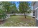 Backyard featuring shed and partial grass cover at 202 Ferryboat Ct, Orlando, FL 32828
