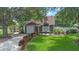Charming single-Gathering home boasts a well-manicured lawn, flower beds, and a cozy front porch at 202 Ferryboat Ct, Orlando, FL 32828