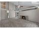 Spacious living room with a vaulted ceiling, cozy fireplace, and ample natural light from sliding glass doors at 202 Ferryboat Ct, Orlando, FL 32828