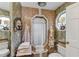 Decorated bathroom featuring a shower, uniquely framed stained glass window and floral accents at 2132 Palm Vista Dr, Apopka, FL 32712