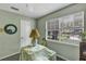 Bright bedroom with a window, table, and a lamp at 2132 Palm Vista Dr, Apopka, FL 32712