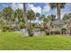 The Palms community entrance featuring fountain, lush landscaping and stone sign at 2132 Palm Vista Dr, Apopka, FL 32712