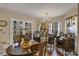 Bright dining area featuring hardwood floors, furniture, and natural light at 2132 Palm Vista Dr, Apopka, FL 32712