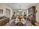 Formal dining room with antique hutch, traditional rug, and table set for meal at 2132 Palm Vista Dr, Apopka, FL 32712