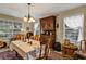 Traditional dining room showcasing antique hutch, table with cloth, and decor at 2132 Palm Vista Dr, Apopka, FL 32712