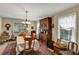 Traditional dining room showcasing antique hutch, table with cloth, and decor at 2132 Palm Vista Dr, Apopka, FL 32712