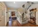 Inviting foyer with hardwood floors, staircase, and dining room at 2132 Palm Vista Dr, Apopka, FL 32712