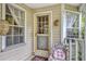 Cozy front porch features a chair and welcoming decor at 2132 Palm Vista Dr, Apopka, FL 32712