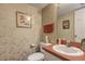 Cozy half bathroom featuring patterned wallpaper and a white sink at 2132 Palm Vista Dr, Apopka, FL 32712
