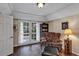 Cozy living room with French doors, hardwood floors, and traditional decor at 2132 Palm Vista Dr, Apopka, FL 32712