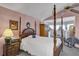 Charming main bedroom showcasing a four-poster bed and pink walls at 2132 Palm Vista Dr, Apopka, FL 32712