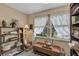 Office with a lovely view from the window, bookshelves, and a wooden table at 2132 Palm Vista Dr, Apopka, FL 32712