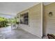 Relaxing porch area with comfortable seating and hanging plants for a tranquil outdoor experience at 2132 Palm Vista Dr, Apopka, FL 32712