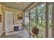 Cozy screened-in porch featuring a porch swing, creating a relaxing outdoor living space at 2132 Palm Vista Dr, Apopka, FL 32712