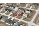 Aerial view showcasing the property's location within a residential neighborhood; neatly lined with paved roads at 2305 Rio Grande Forest Ln, Kissimmee, FL 34759