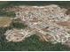Aerial shot displaying the property within its neighborhood, highlighting the community layout and surrounding green spaces at 2305 Rio Grande Forest Ln, Kissimmee, FL 34759