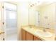 Bright bathroom featuring a double sink vanity, and shower with tile flooring at 2305 Rio Grande Forest Ln, Kissimmee, FL 34759