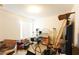 Bedroom with items stacked on floor and furniture; natural light from window at 2305 Rio Grande Forest Ln, Kissimmee, FL 34759