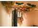 Walk-in closet with items on shelf and clothes hanging on the rod at 2305 Rio Grande Forest Ln, Kissimmee, FL 34759